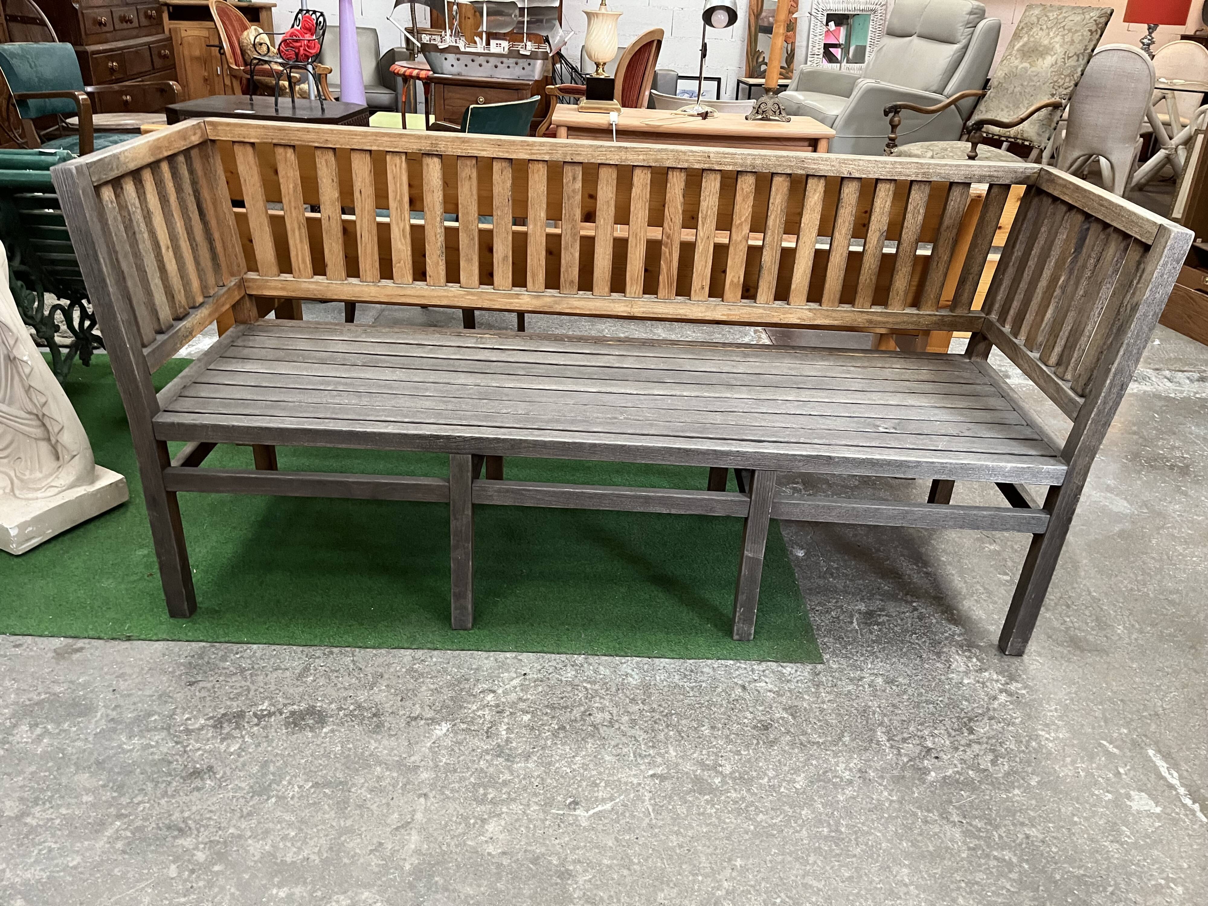 Colonial-style teak bench