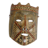 Terracotta mask with geometric decorations