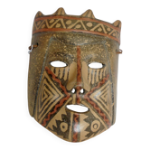 Terracotta mask with geometric decorations
