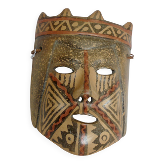 Terracotta mask with geometric decorations