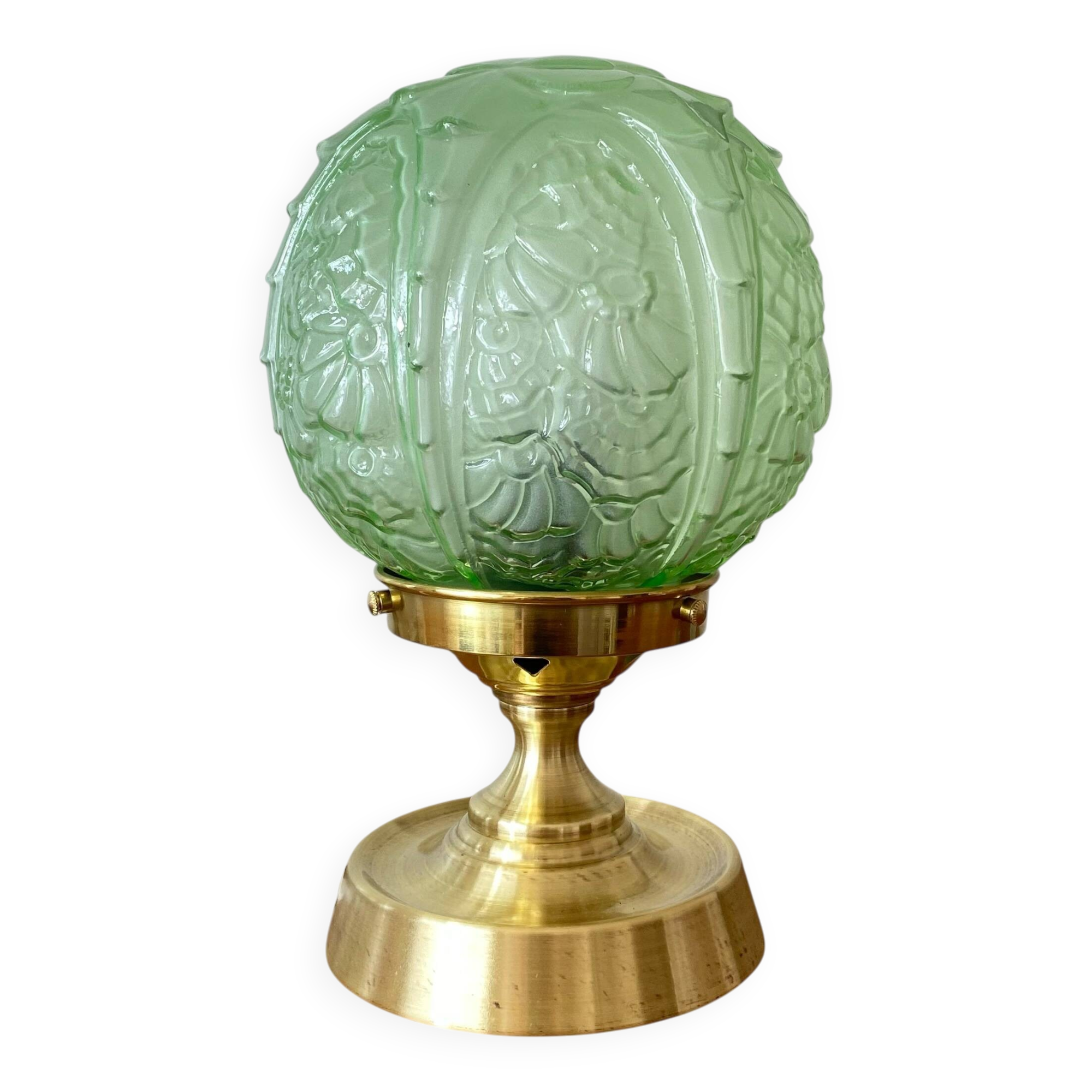 Art Deco green moulded glass globe table lamp with a brass base.
