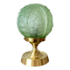 Art Deco green moulded glass globe table lamp with a brass base.