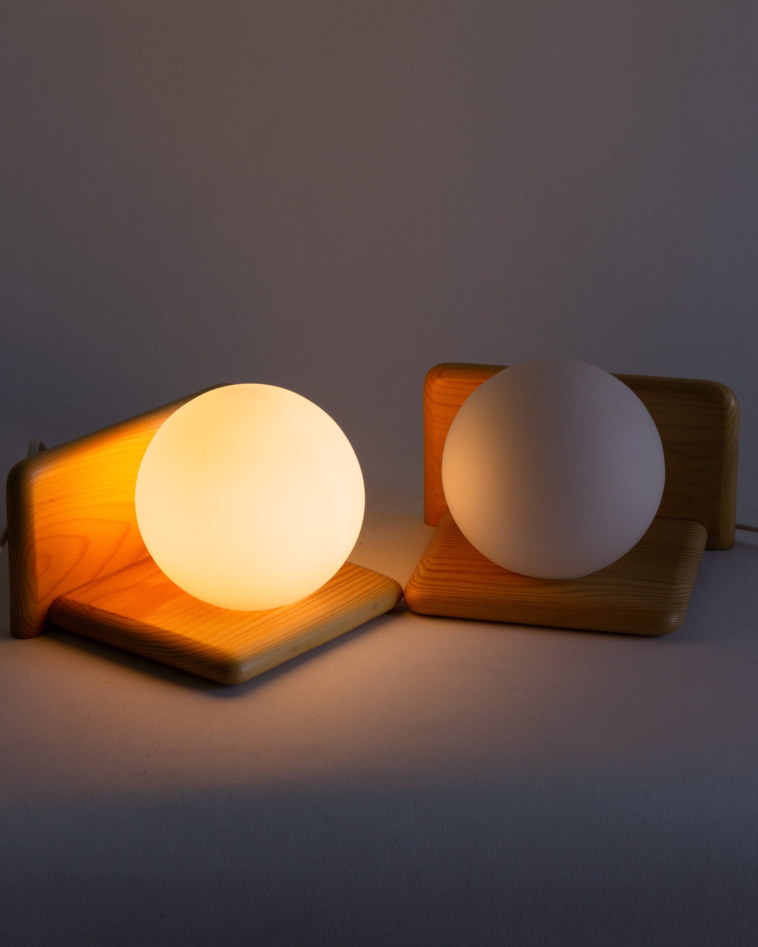 Duo of pine and opaline glass wall lights, 1980s