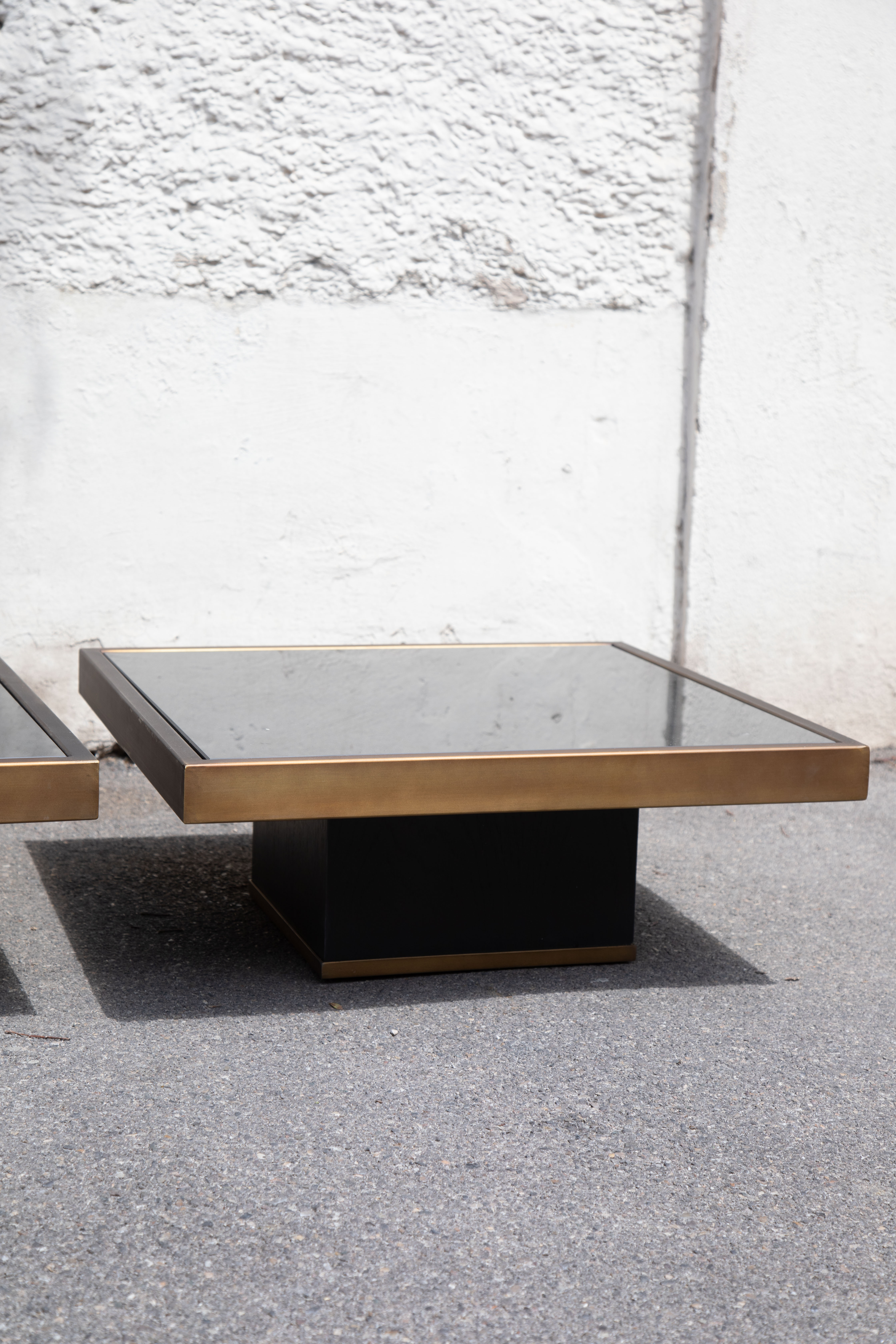 Pair of coffee tables brass black glass