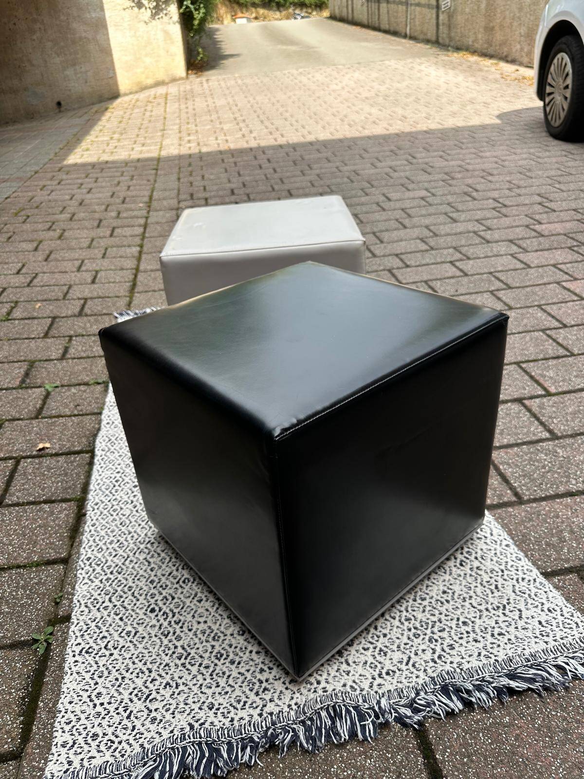 Pair of designer poufs in faux leather