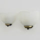 Pair of Vianne wall sconces in gilded metal and white shell-style glass