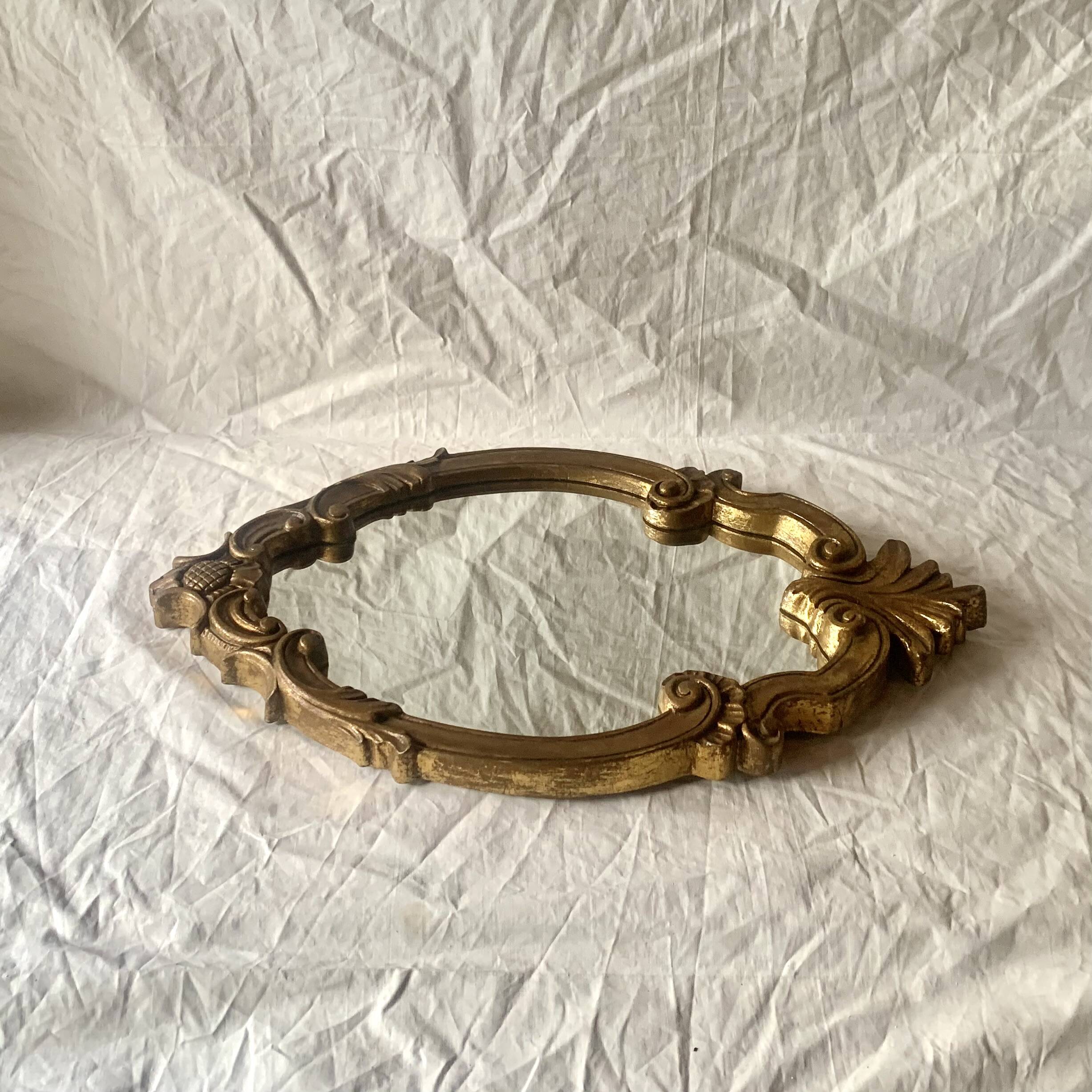 Vintage wall mirror in gold resin