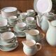 Villeroy & Boch table service in celadon green and ivory, 102 pieces.