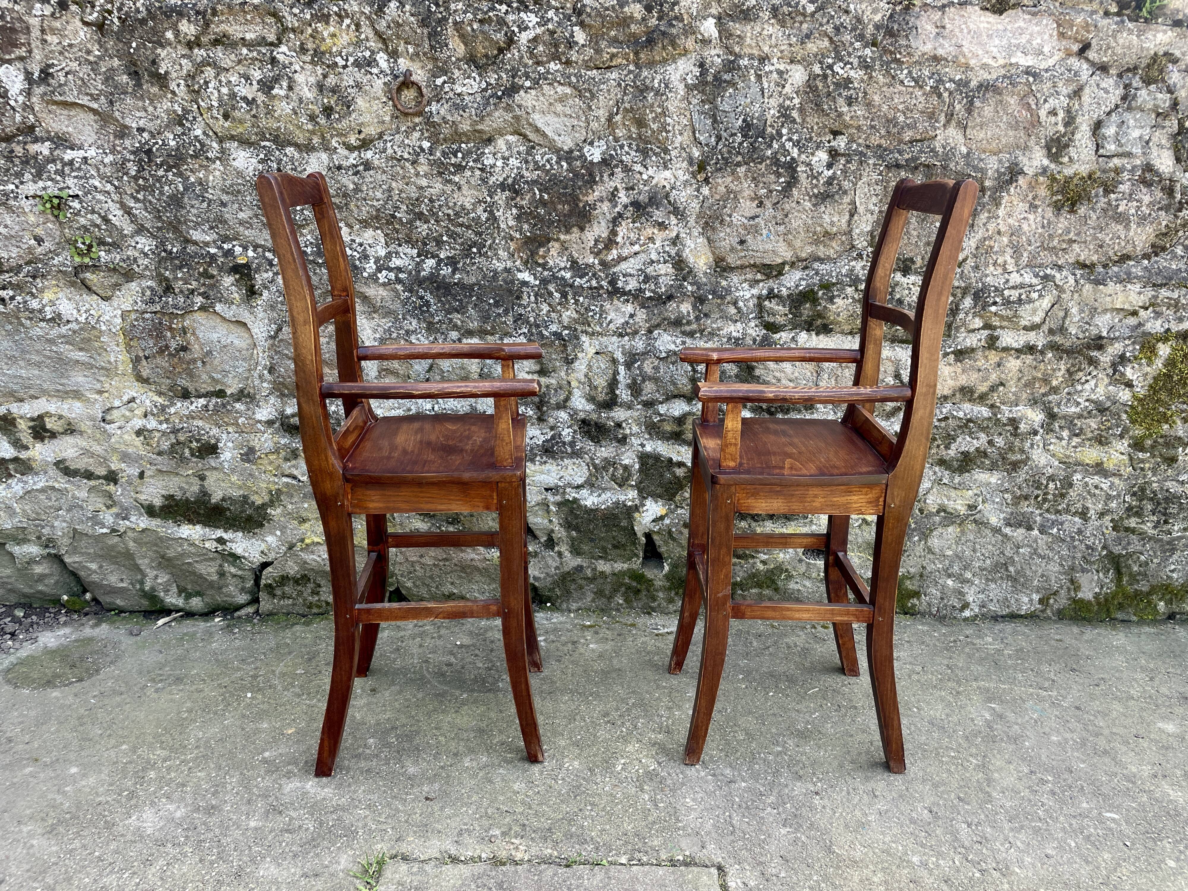Pair of children's high chairs, early 20th century craftsmanship.