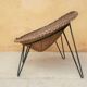 Fauteuil vintage en rotin pieds métal