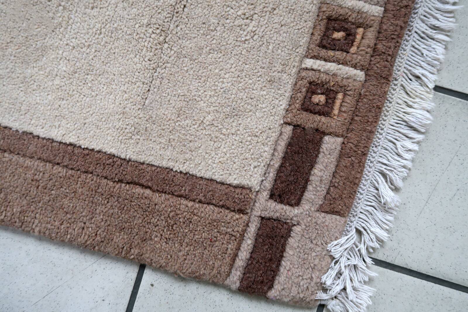 Tapis vintage tibétain Khaden fait main en laine – 64 x 124 cm  Années 1970