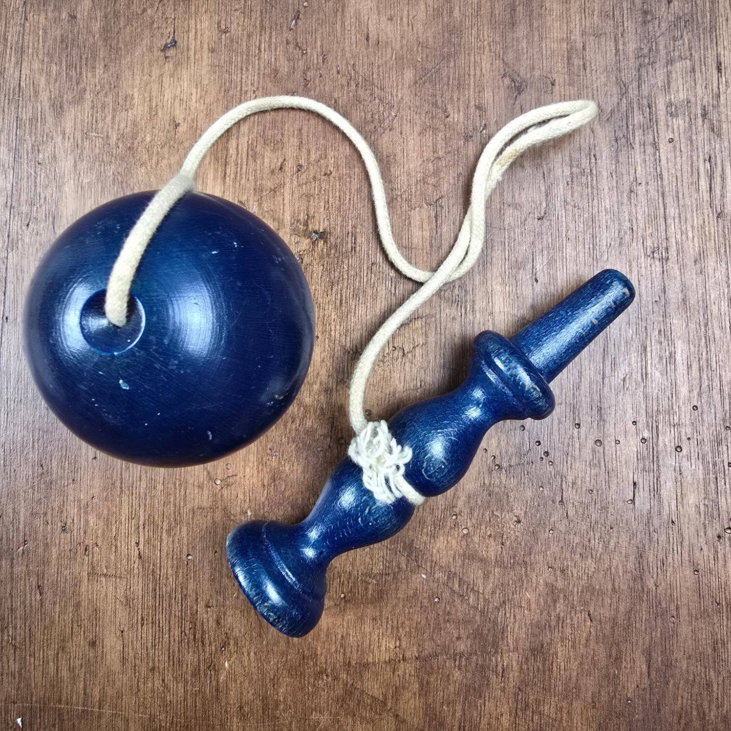 Antique navy blue wooden cup-and-ball toy – Vintage skill toy