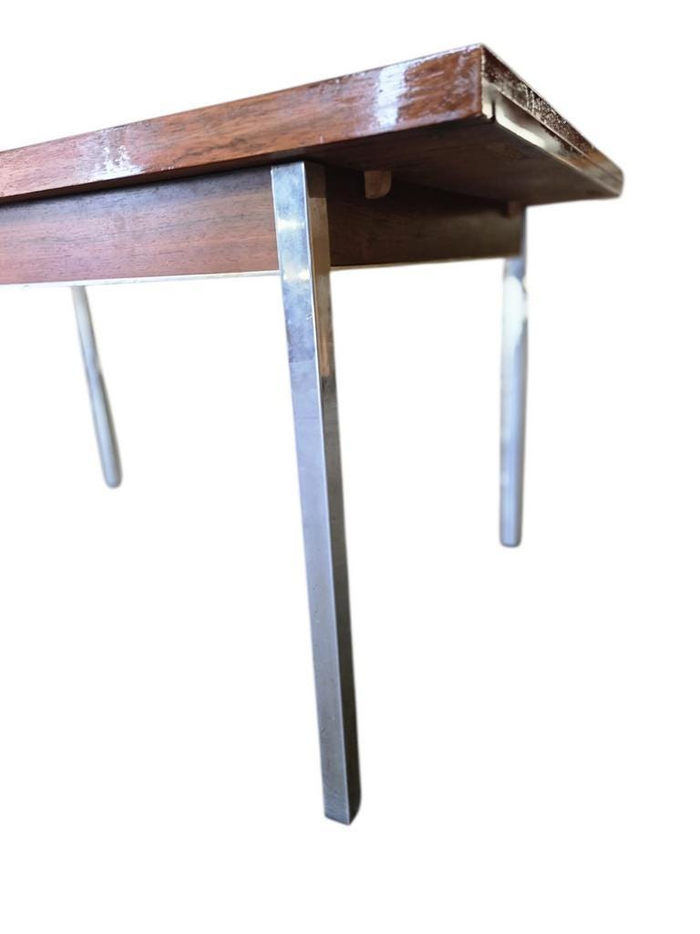 Vintage wooden dining table with chrome frame.