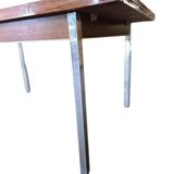Vintage wooden dining table with chrome frame.