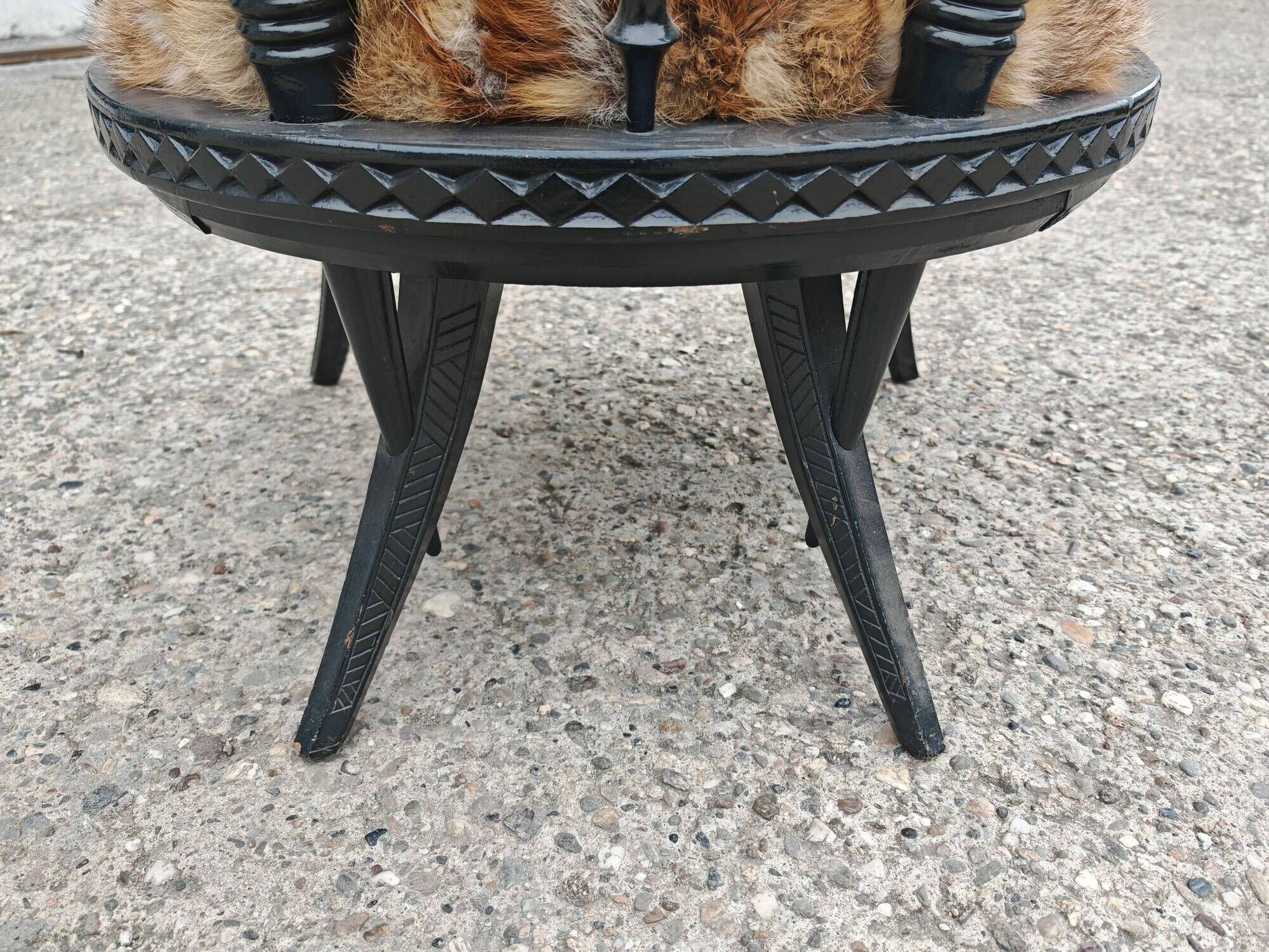 Pair of hand-carved armchairs in black lacquer and fur, 1920s.