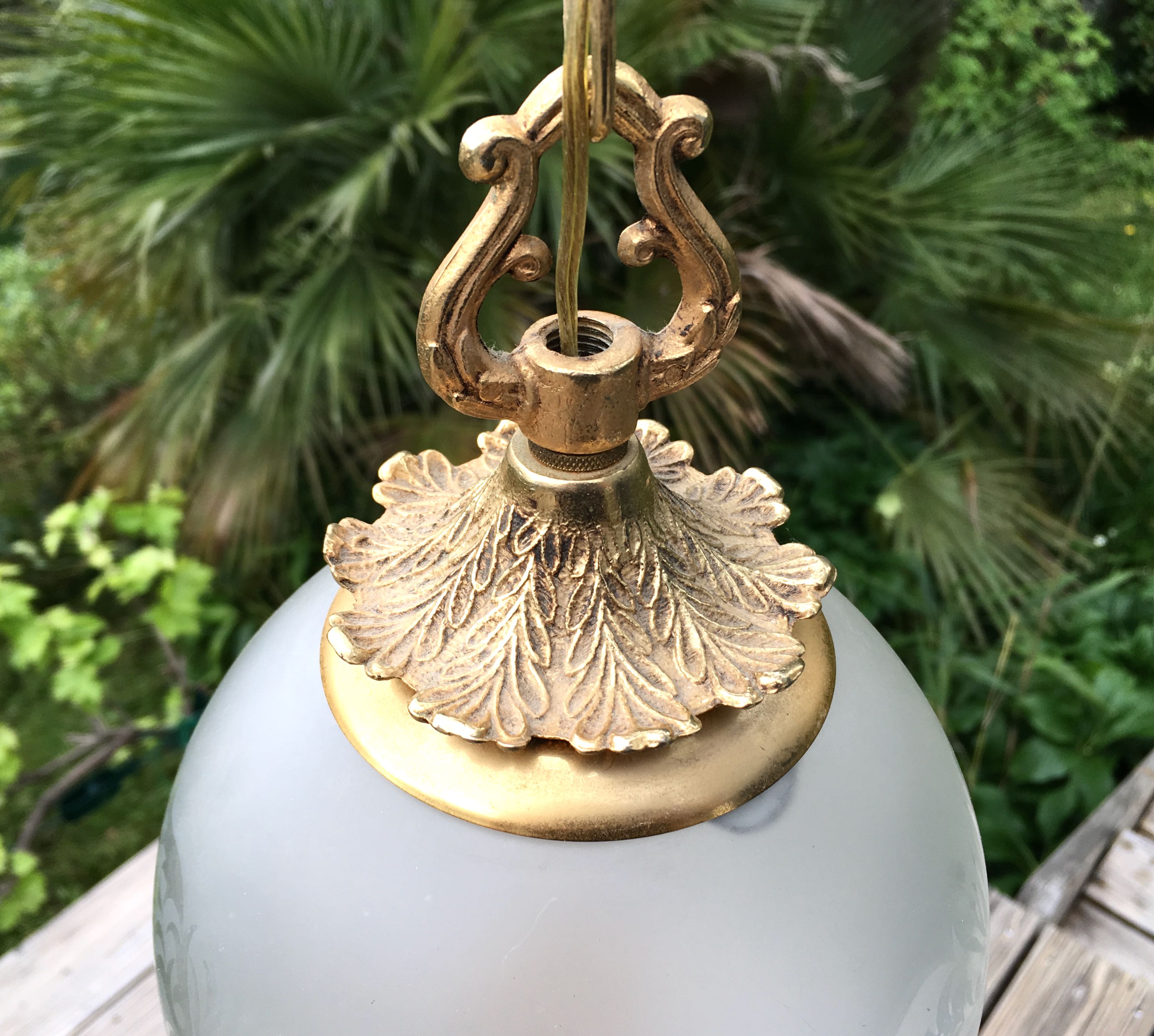 Floral globe and gold metal hanging lamp