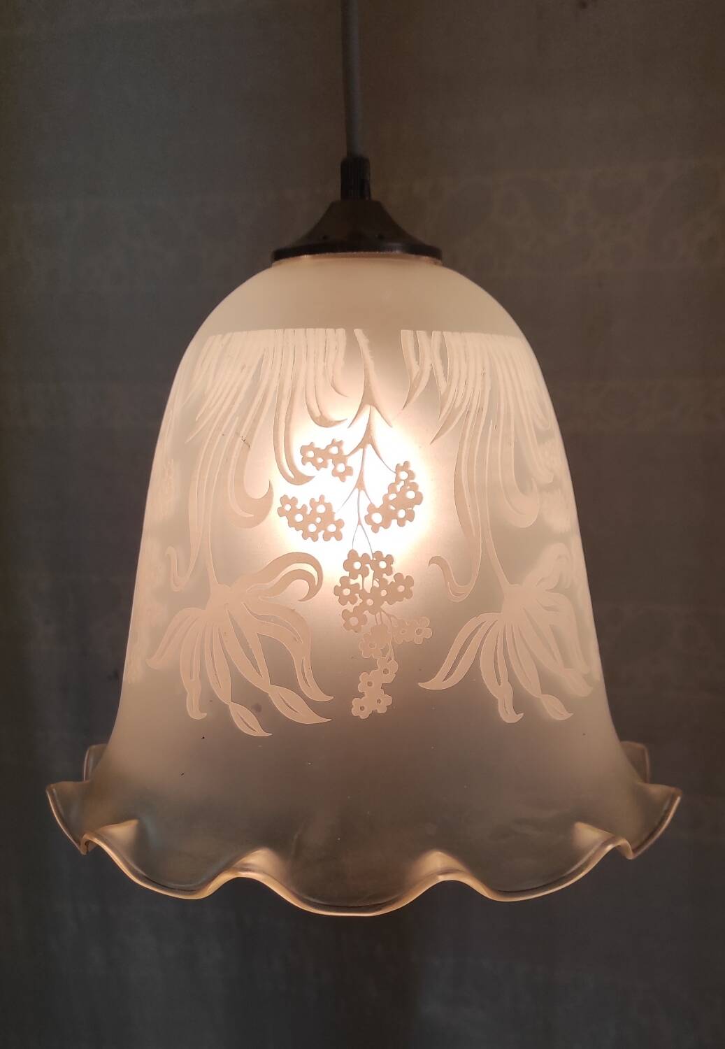 Suspension style Art Nouveau glass globe with screen-printed floral pattern.