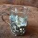 Set of 3 small metal glasses and saucers