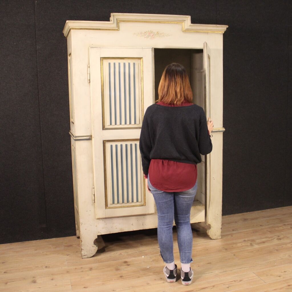 Antique lacquered and gilded Italian wardrobe in Louis XVI style from 19th century
