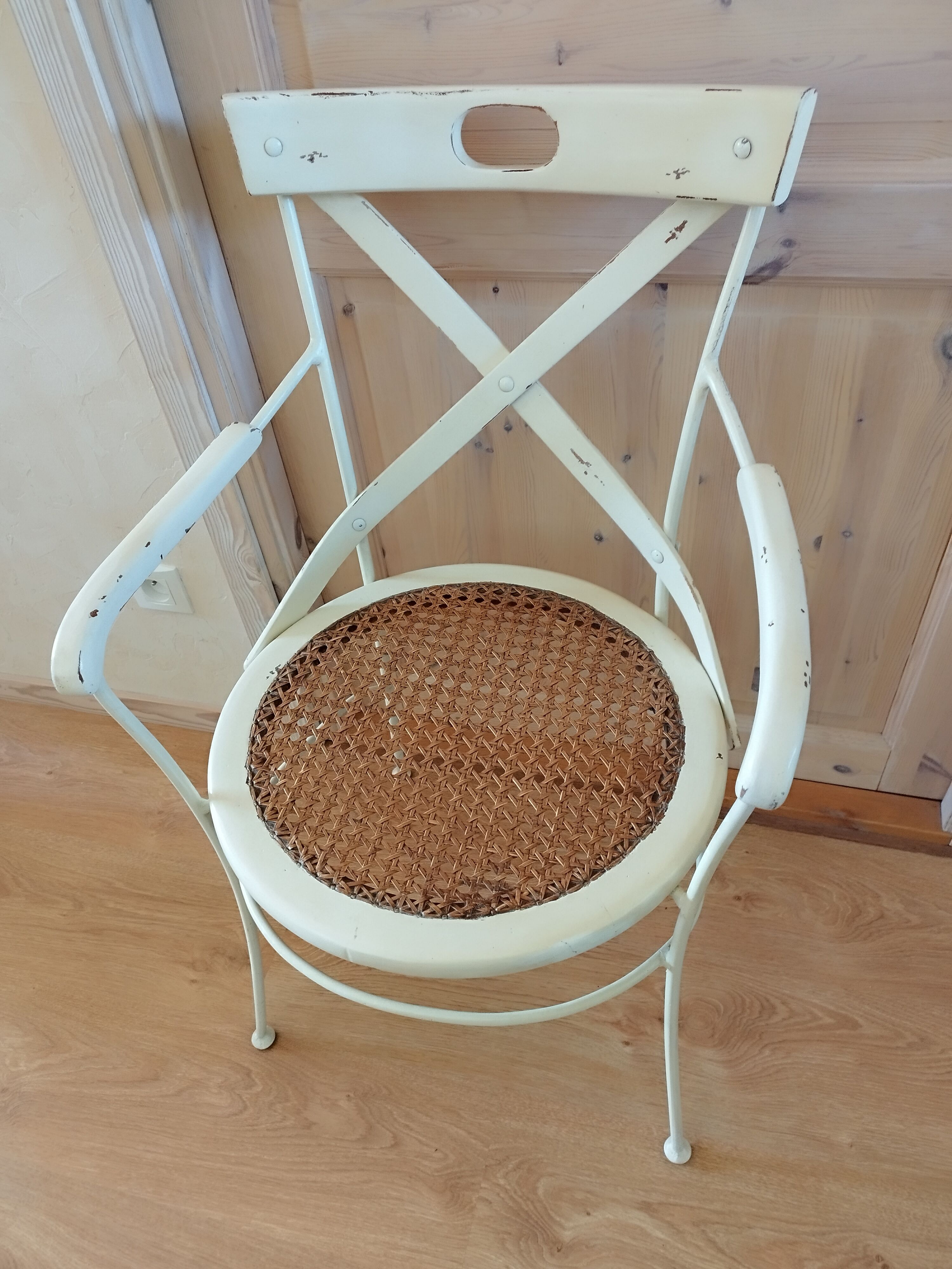 Canned chair with wooden and metal braces