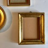 Trio of round golden wood frames and rectangles
