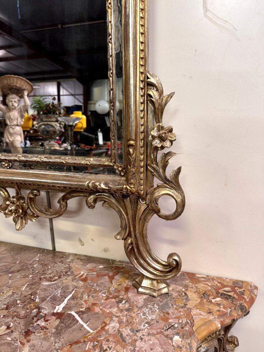 Important console table with a curved shape + Louis XV style mirror in gilded and silvered wood.