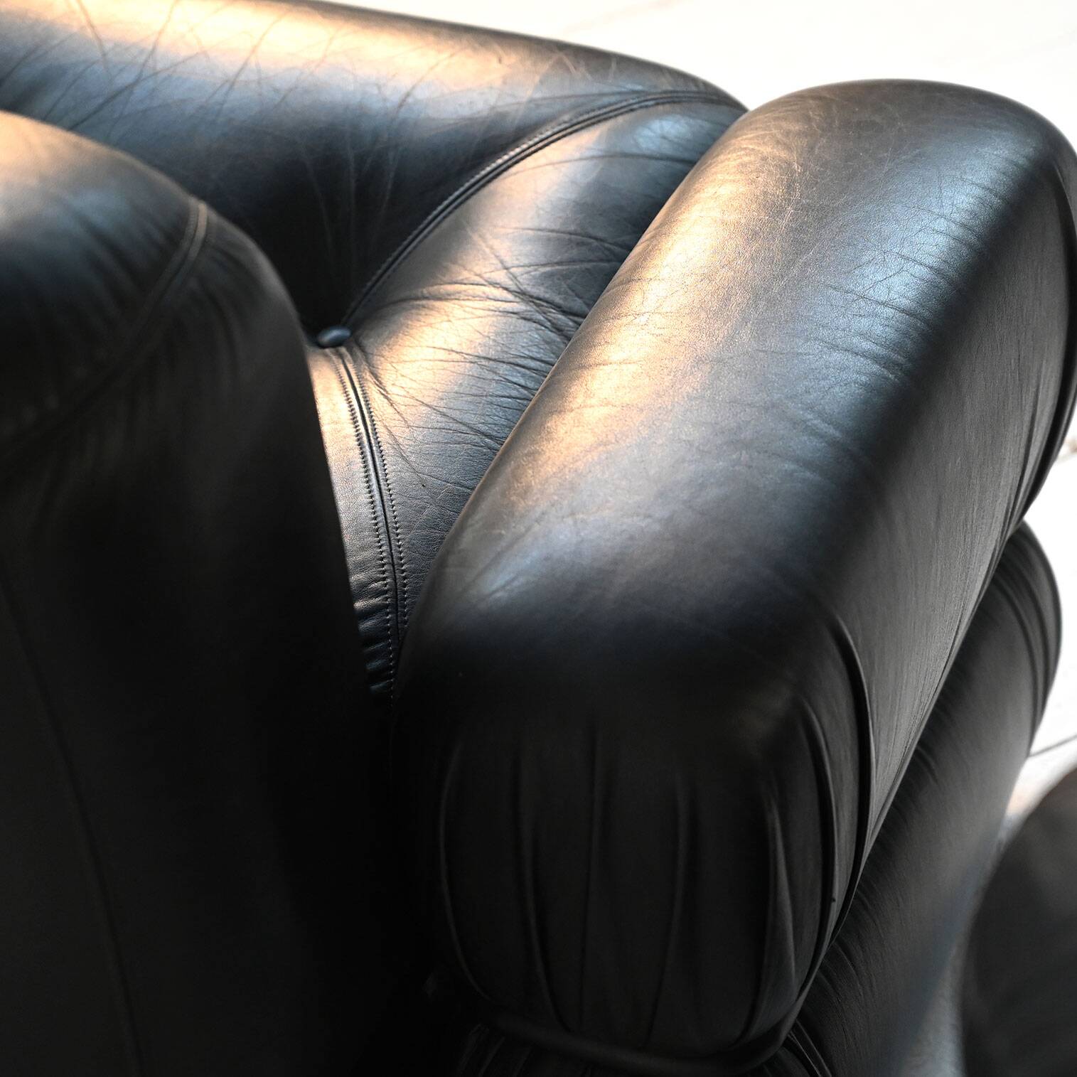 Black leather and tubular steel armchairs, 1970s