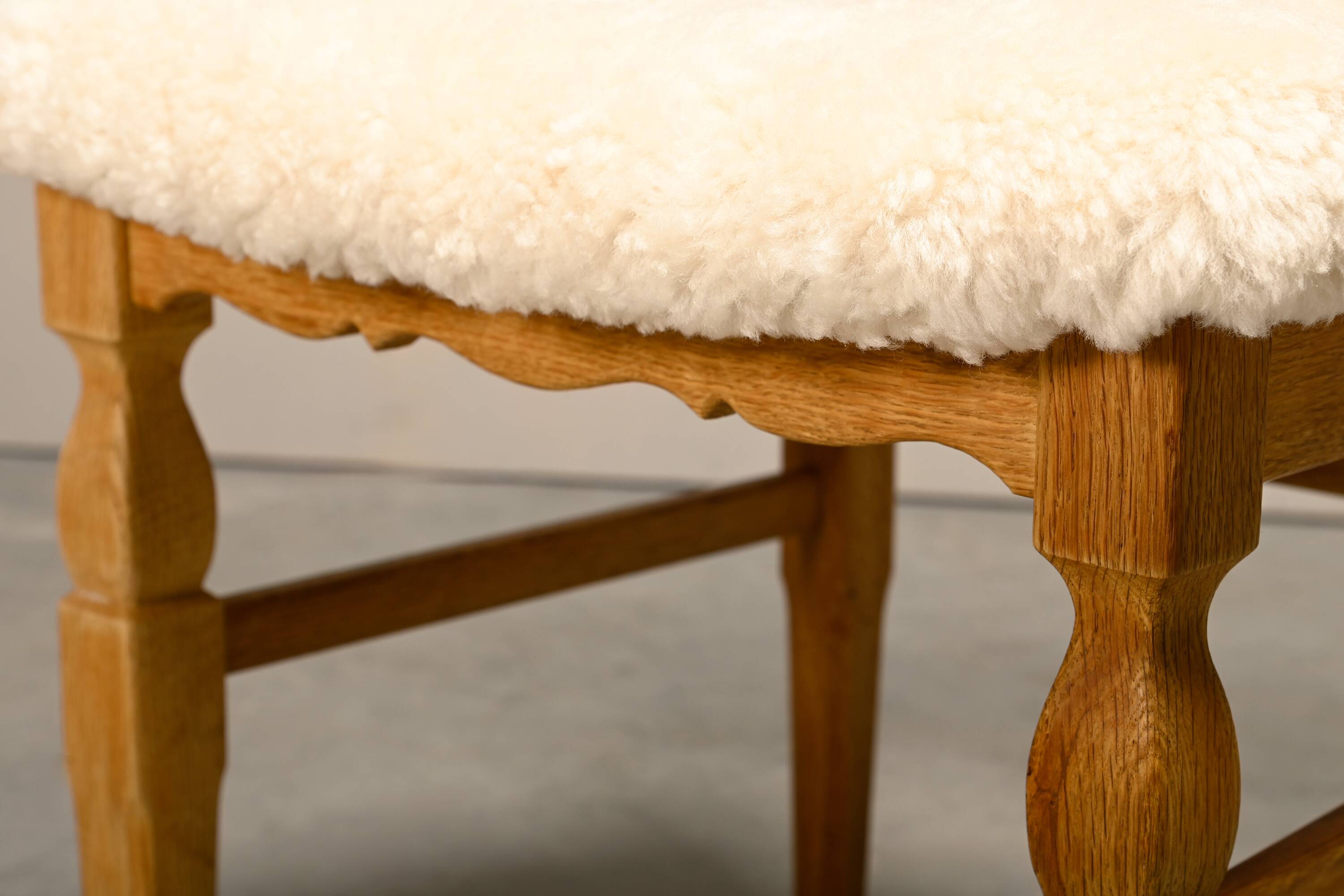 Henning Kjærnulf dining chairs set in Oak and Sheepskin, Denmark, 1960s