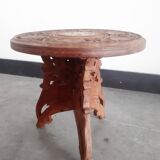 Carved wooden hunting stool decorated with vines