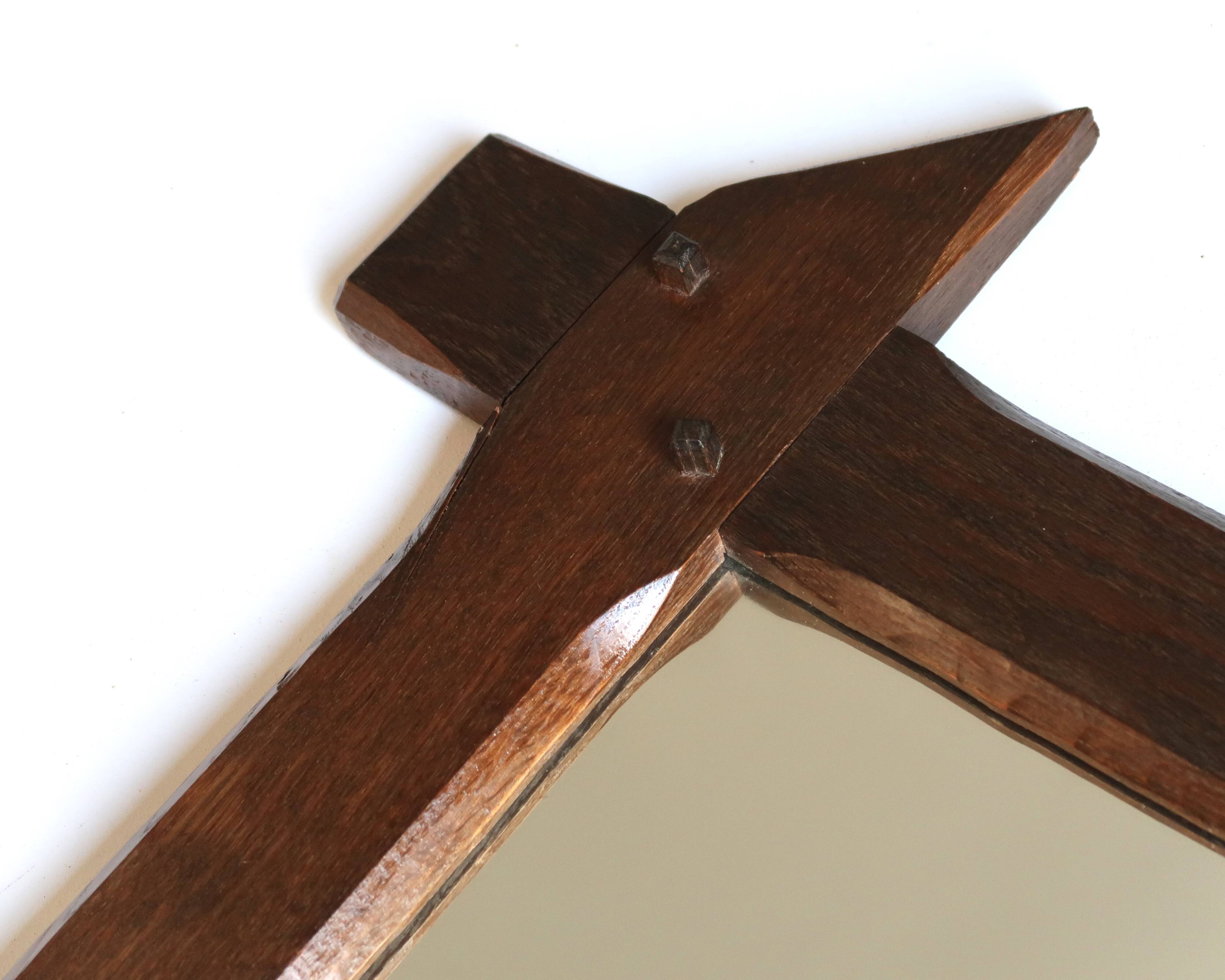 Rectangular mirror with bevelled wooden frame, 1970s.