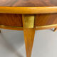 Round walnut Napoleon III extendable table with bronze top in good condition.