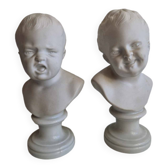 Pair of busts in biscuit and Limoges porcelain, laughing child crying child