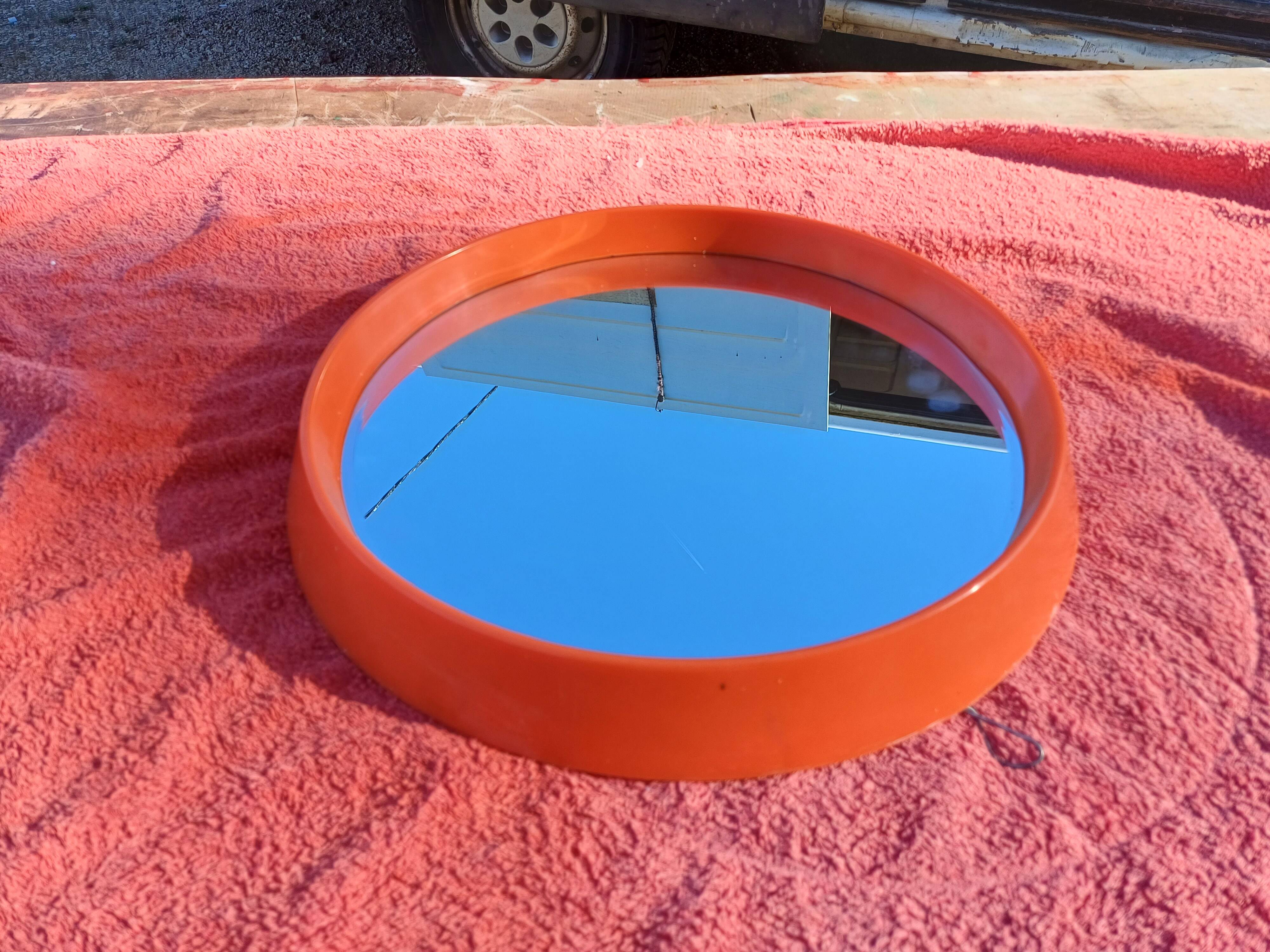 Vintage round plastic orange mirror