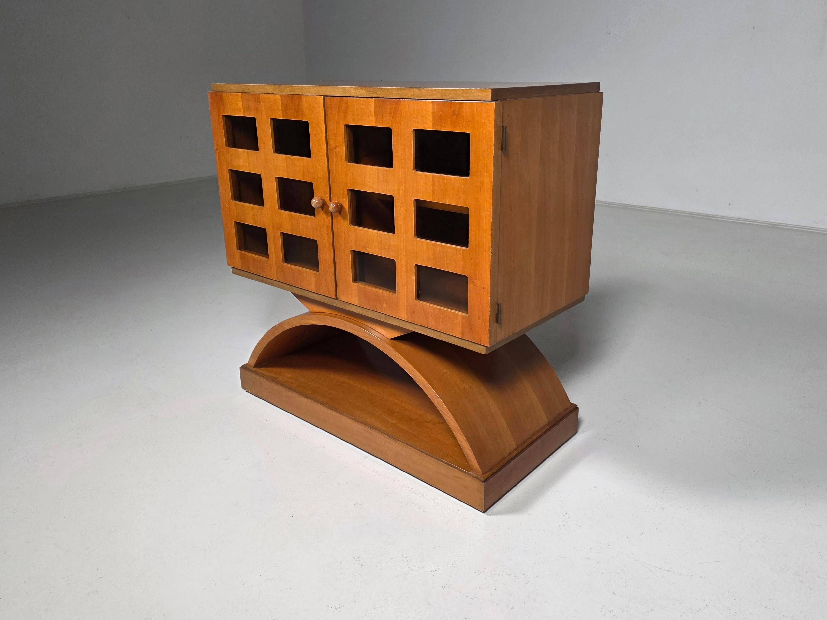 Mid-century modern mobile bar cabinet with sculptural base, 1950s.
