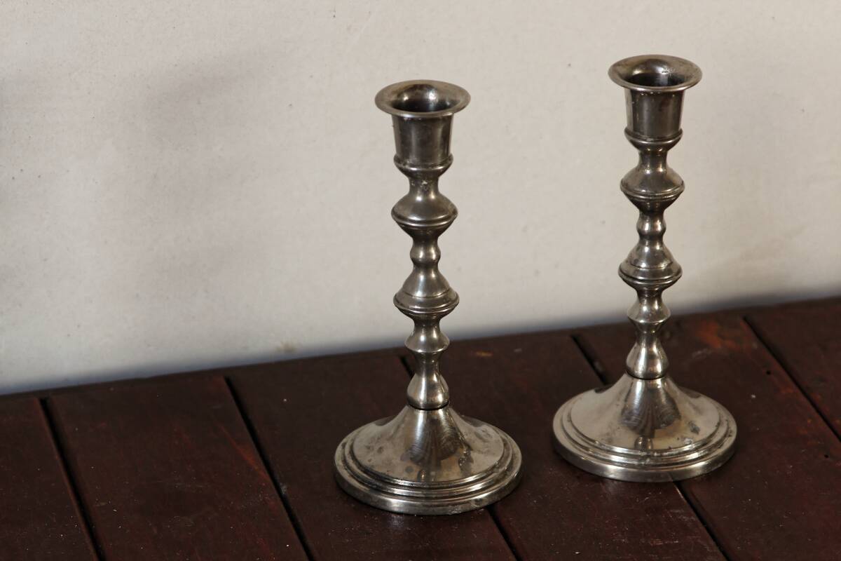Pair of silver metal candlesticks