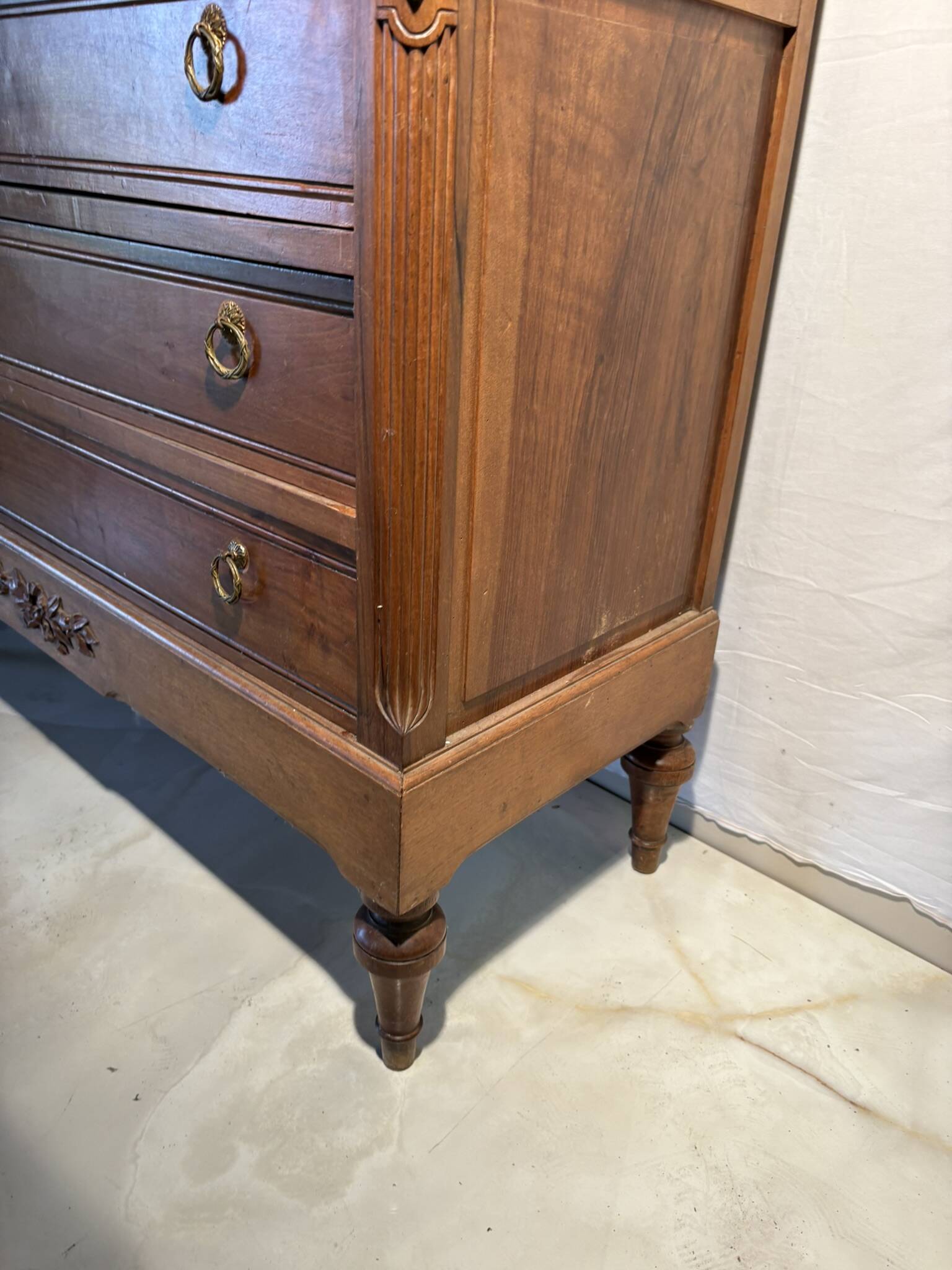 Antique carved wooden dressing table with marble and tilting oval mirror.