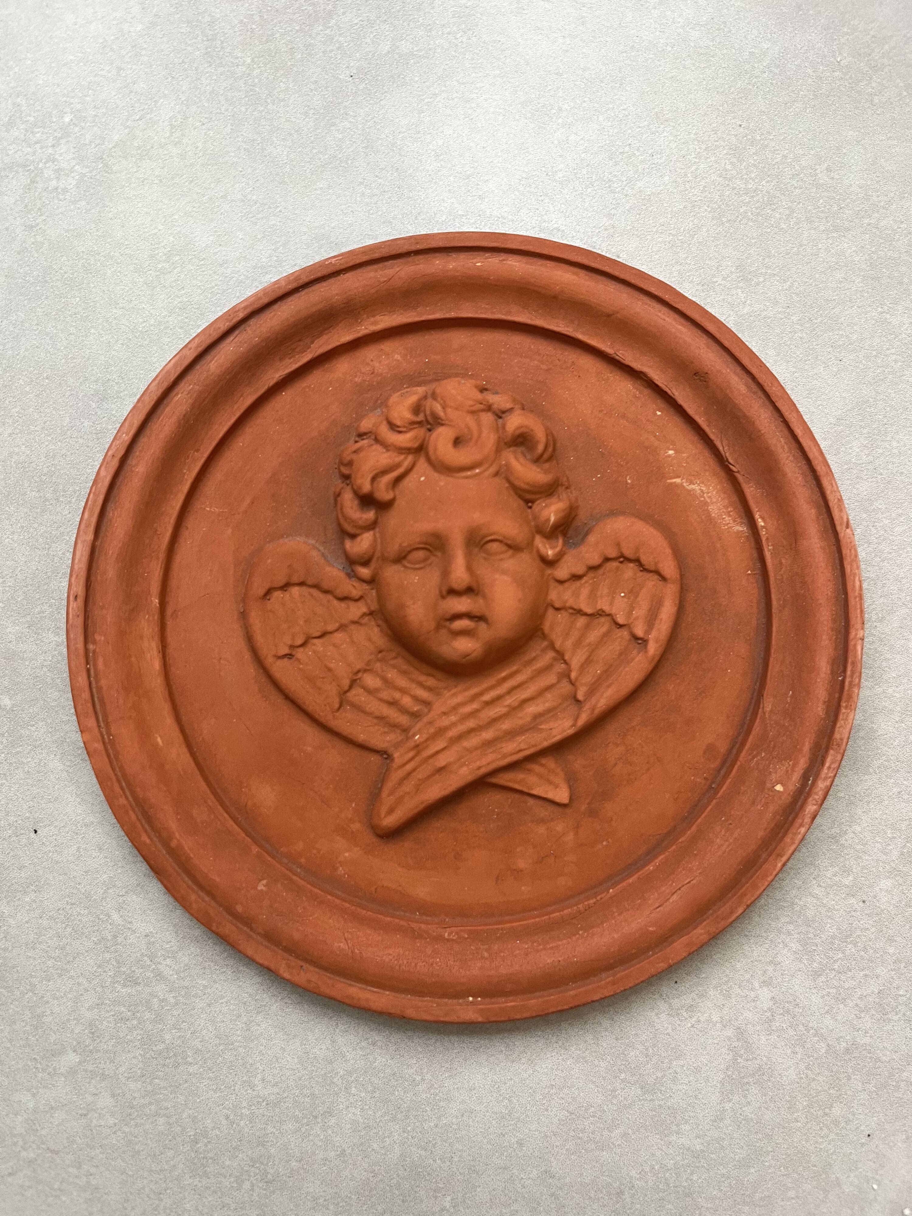 Hanging rondel "Cherub" terracotta