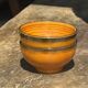 Pair of small orange bowls with black edging
