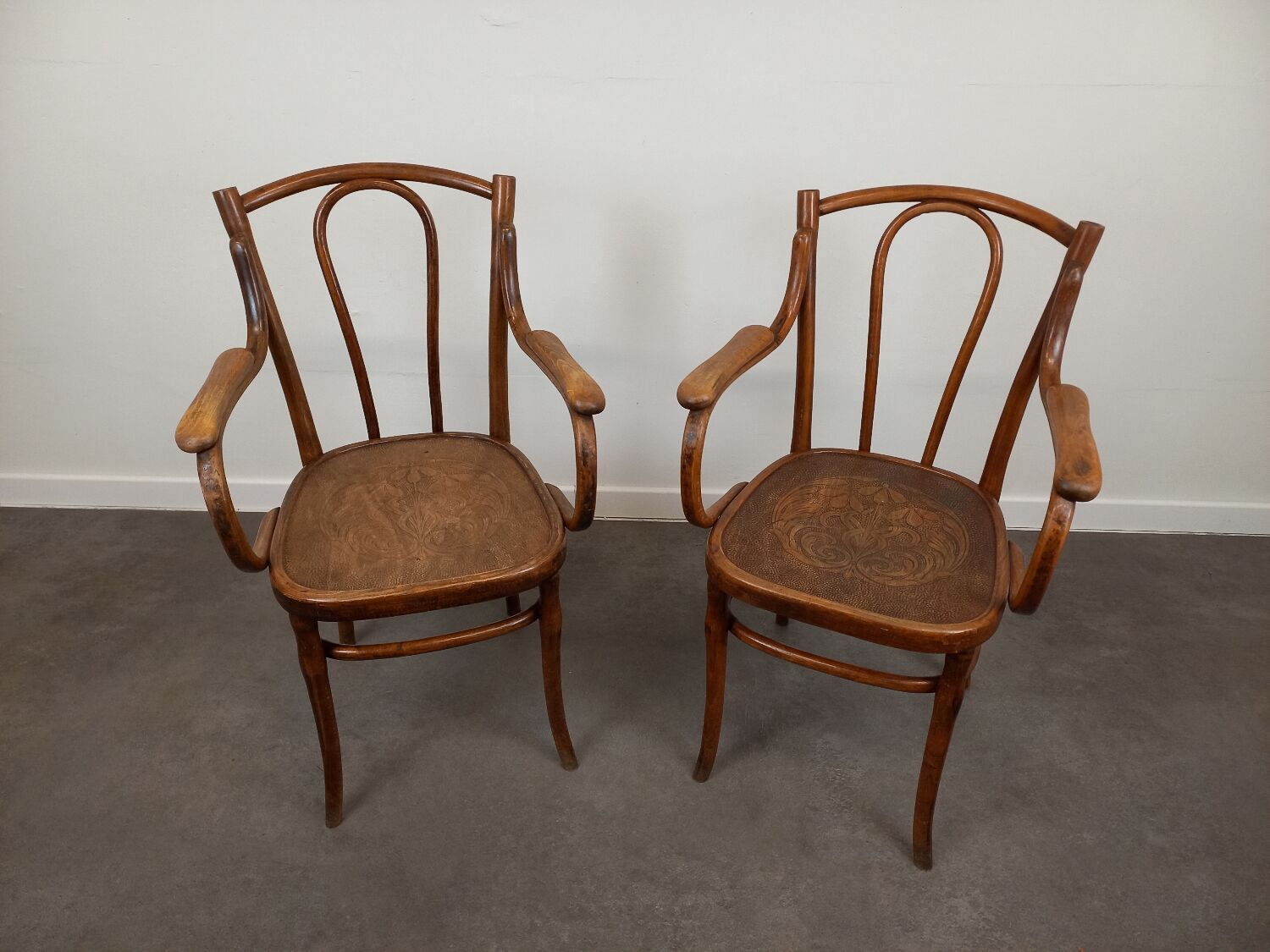 Pair of curved wooden bistro armchairs