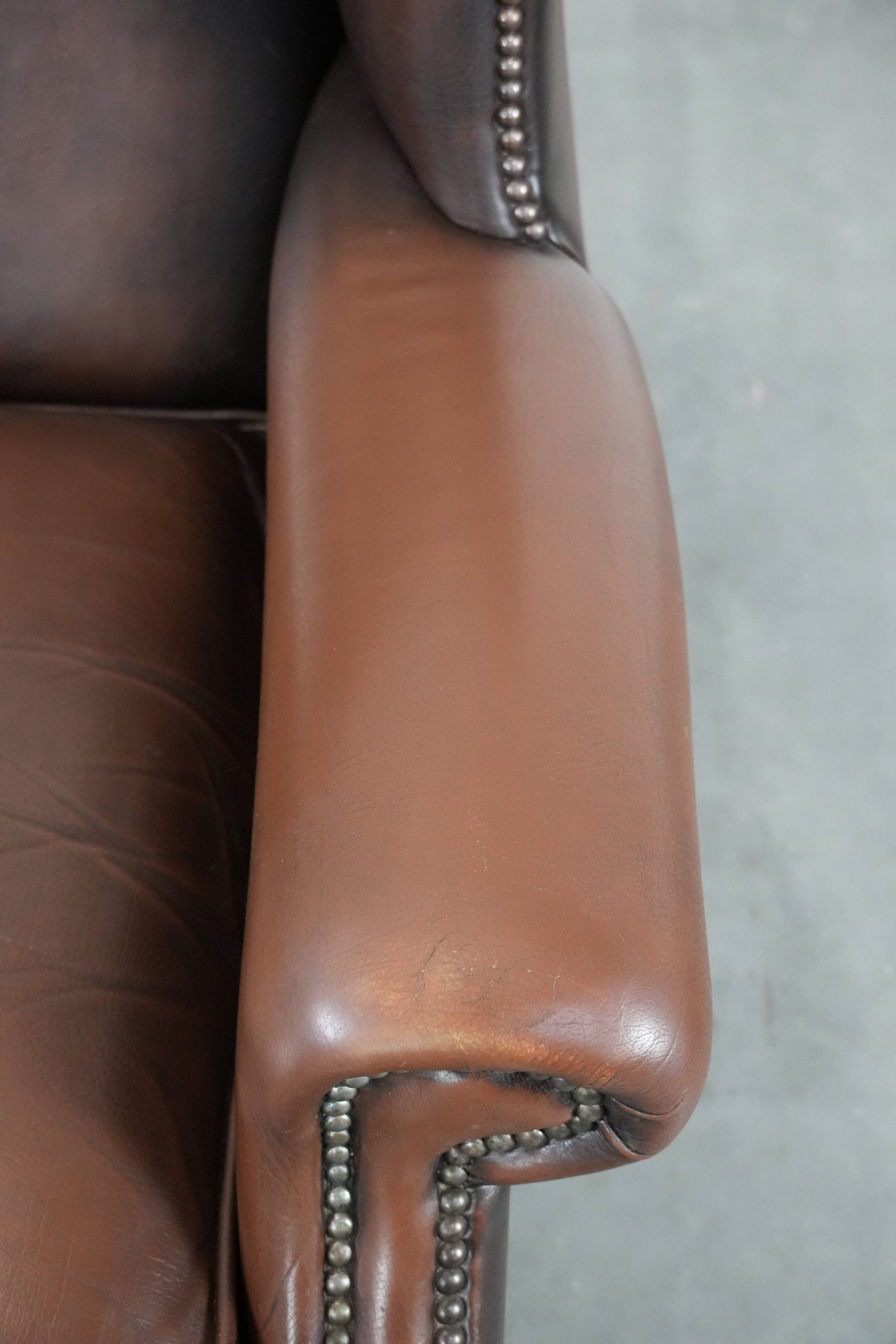 Brown smooth cow leather Chesterfield wingback armchair in English style