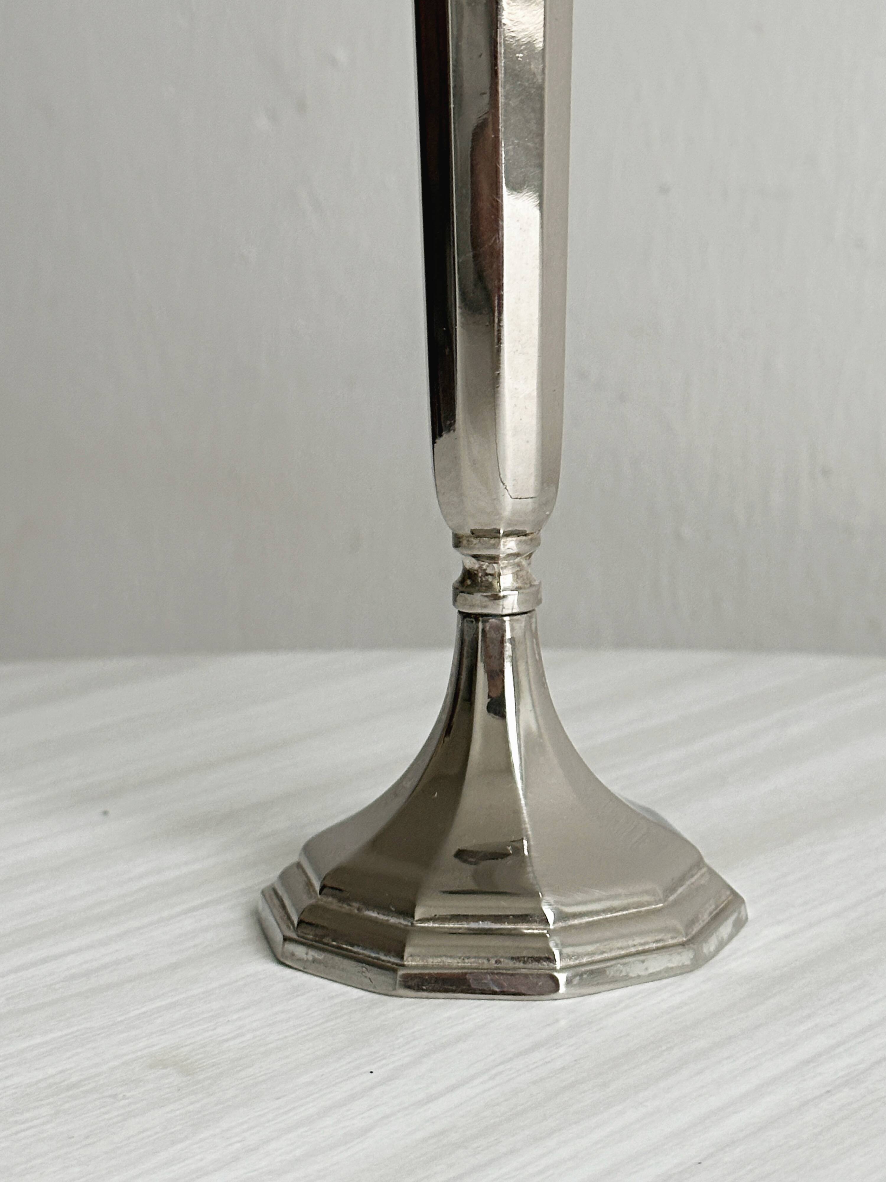 single flower vase or metal candlestick