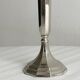 single flower vase or metal candlestick