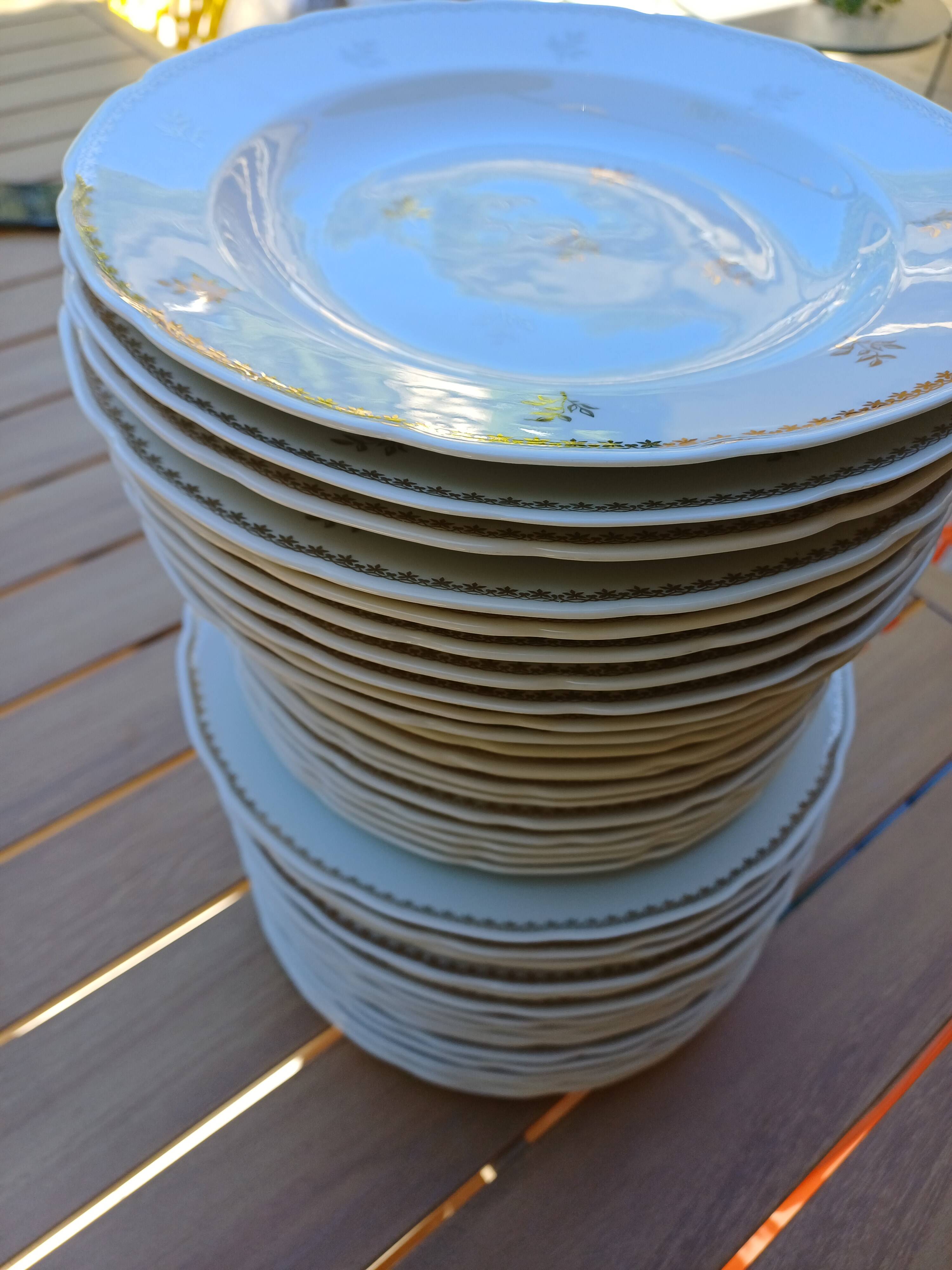 A lot of old white and gold porcelain plates T de F.