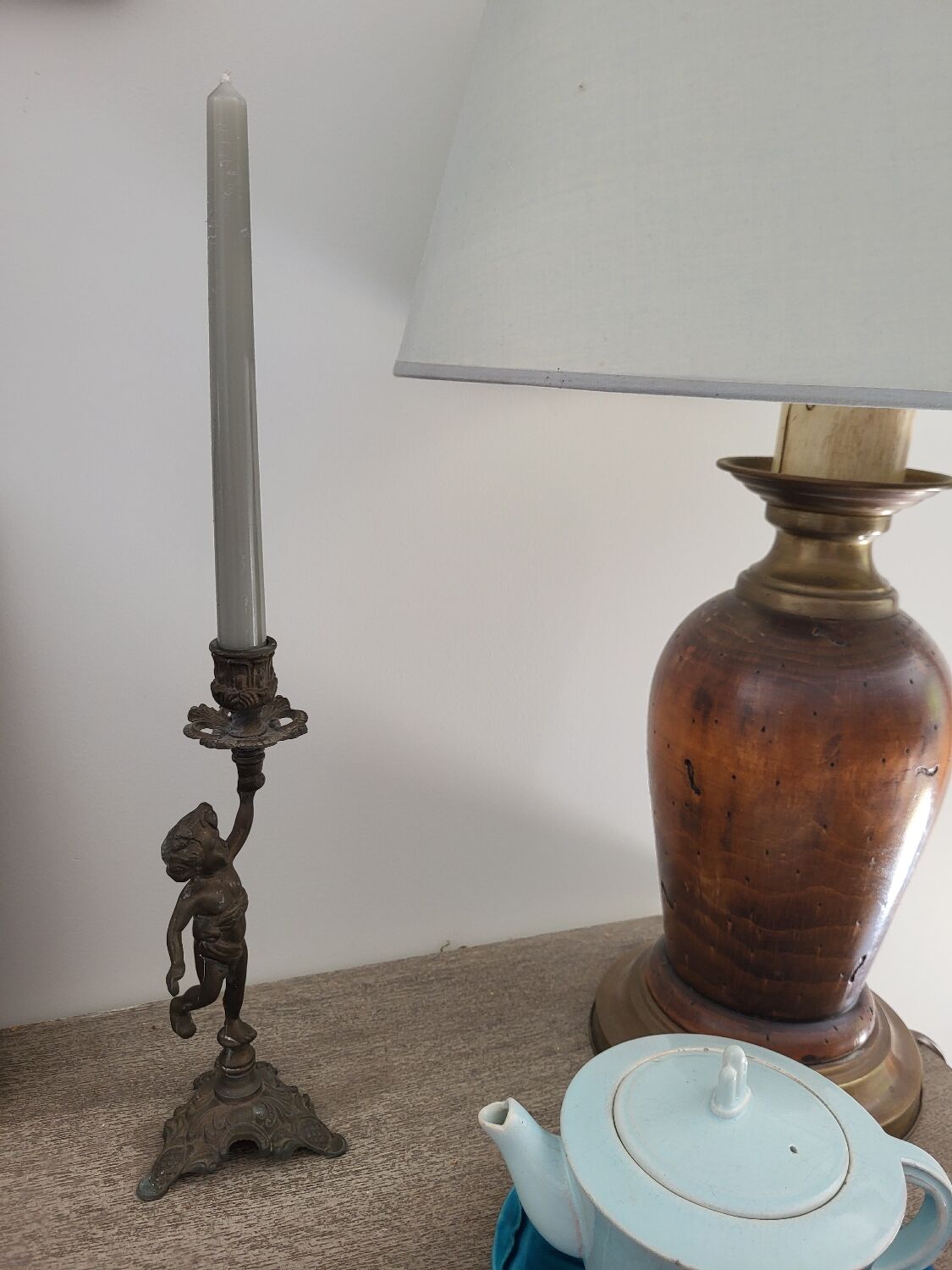 Pewter gray cherub candle holder.