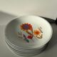 Ensemble vintage d'assiettes porcelaine de Sologne à motif floral stylisé