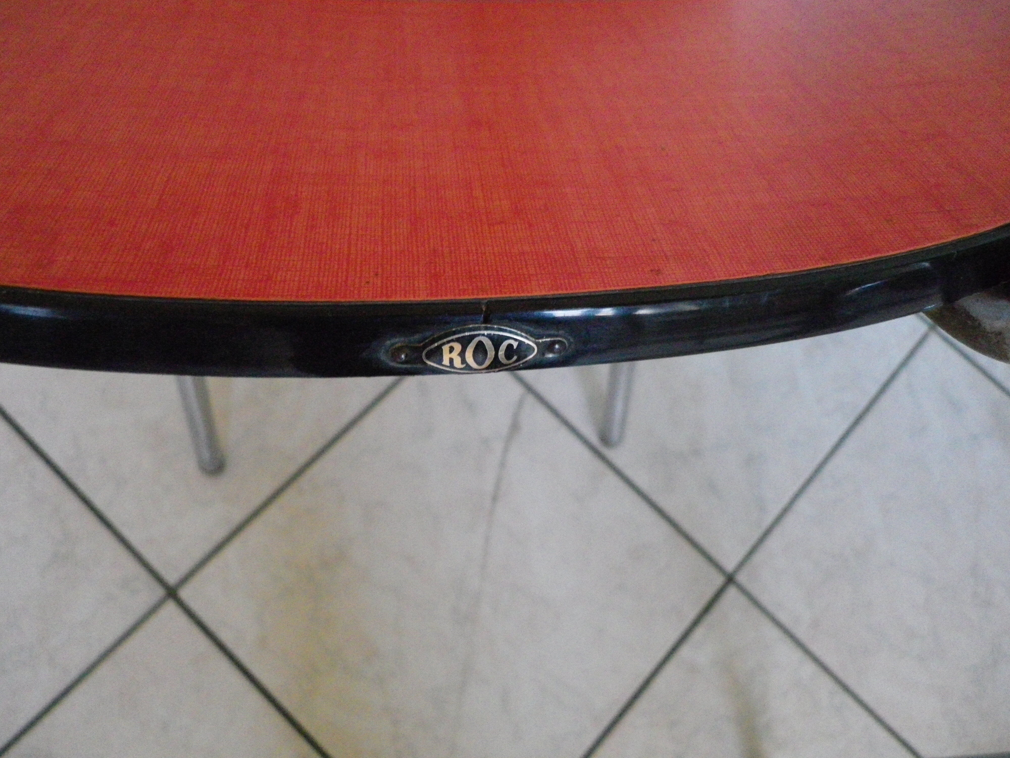 Table in red formica, 4 roc chairs, 2 extension cords, 2 drawers 60