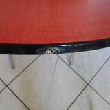 Table in red formica, 4 roc chairs, 2 extension cords, 2 drawers 60