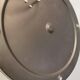 Ceiling light, in dark metallic paint with thick glass shade with beautiful details in the glass.