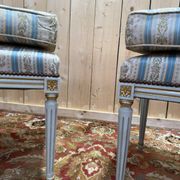 Pair of Louis XVI benches in lacquered and gilded wood