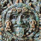 Aztec/Mayan wall solar mirror, in crushed Malachite stone, gold highlights